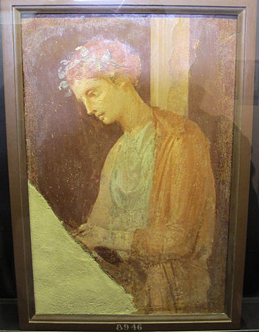 Young Roman girl reading 